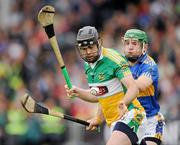18 July 2010; Paul Cleary, Offaly, in action against Noel McGrath, Tipperary. GAA Hurling All-Ireland Senior Championship Phase 3, Tipperary v Offaly, O'Moore Park, Portlaoise, Co. Laois. Picture credit: Ray McManus / SPORTSFILE