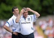 18 July 2010; Monaghan manager Seamus McEnaney show his frustration during the game, along with trainer Martin McElkennon, left. Ulster GAA Football Senior Championship Final, Monaghan v Tyrone, St Tighearnach's Park, Clones, Co. Monaghan. Picture credit: Oliver McVeigh / SPORTSFILE
