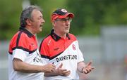 18 July 2010; Tyrone manager Mickey Harte, right, in discusson with his assistant manager, Tony Donnelly, on the sideline. Ulster GAA Football Senior Championship Final, Monaghan v Tyrone, St Tighearnach's Park, Clones, Co. Monaghan. Picture credit: Oliver McVeigh / SPORTSFILE