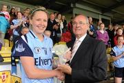 18 July 2010; Sean McMullin, President of the Leinster Council of Cumann Peil Gael na mBan, presents the TG4 player of the match award to Amy McGuinness, Dublin at the end of the game. TG4 Ladies Football Leinster Senior Championship Final, Laois v Dublin, Dr. Cullen Park, Carlow. Picture credit: David Maher / SPORTSFILE