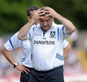 18 July 2010; A frustrated Monaghan manager Seamus McEnaney, right, along with trainer Martin McElkennon. Ulster GAA Football Senior Championship Final, Monaghan v Tyrone, St Tighearnach's Park, Clones, Co. Monaghan. Picture credit: Oliver McVeigh / SPORTSFILE