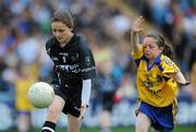 18 July 2010; Karen Tansey, Knockmina N.S. Sligo, in action against Martina McDonagh, Derryglin N.S., Galway, during the Go Games at half-time during Connacht GAA Football Senior Championship Final. McHale Park, Castlebar, Co. Mayo. Picture credit: Brian Lawless / SPORTSFILE
