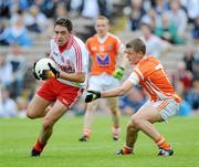 18 July 2010; Ryan Devlin, Tyrone, in action against Niall McConville, Armagh. ESB Ulster GAA Football Minor Championship Final, Tyrone v Armagh, St Tighearnach's Park, Clones, Co. Monaghan. Picture credit: Oliver McVeigh / SPORTSFILE