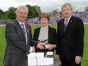 18 July 2010; Ulster GAA President Aoghan Farrell, left and GAA Director General Páraic Duffy, right, with Nuala Carey wife of the late Jarleth Carey, honoured as a member of the Down Jubilee teams of 1960-61 during the Ulster GAA Football Finals. St Tighearnach's Park, Clones, Co. Monaghan. Picture credit: Oliver McVeigh / SPORTSFILE
