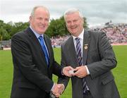 18 July 2010; Ulster GAA President Aoghan Farrell, right, with Hugo Clerkin, honoured as a Captain of the Monaghan Jubilee team of 1985, during the Ulster GAA Football Finals. St Tighearnach's Park, Clones, Co. Monaghan. Picture credit: Oliver McVeigh / SPORTSFILE
