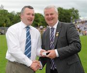 18 July 2010; Ulster GAA President Aoghan Farrell, right, with Paul Curran, honoured as a Captain of the Monaghan Jubilee team of 1985, during the Ulster GAA Football Finals. St Tighearnach's Park, Clones, Co. Monaghan. Picture credit: Oliver McVeigh / SPORTSFILE