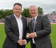 18 July 2010; Ulster GAA President Aoghan Farrell, right, with Anthony McArdle, honoured as a Captain of the Monaghan Jubilee team of 1985, during the Ulster GAA Football Finals. St Tighearnach's Park, Clones, Co. Monaghan. Picture credit: Oliver McVeigh / SPORTSFILE