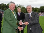 18 July 2010; Ulster GAA President Aoghan Farrell, right, with Gerry Smyth, honoured as a Captain of the Monaghan Jubilee team of 1985, during the Ulster GAA Football Finals. St Tighearnach's Park, Clones, Co. Monaghan. Picture credit: Oliver McVeigh / SPORTSFILE *