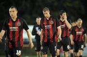 20 July 2010; Dejected Bohemians players, from left to right, Mark Quigley, Jason McGuinness, Ken Oman and Owen Heary leave the field at the end of the game. UEFA Champions League First Qualifying Round, 2nd Leg, The New Saints FC v Bohemians, Park Hall Stadium, Oswestry, Wales. Picture credit: David Maher / SPORTSFILE
