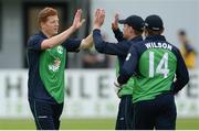 16 June 2016; Kevin O’Brien, left, of Ireland is congratulated by team captain William Porterfield, second right, after bowling and catching out Sri Lanka's Kusal Mendis during the One Day International match between Ireland and Sri Lanka at Malahide Cricket Ground in Malahide, Dublin. Photo by Seb Daly/Sportsfile