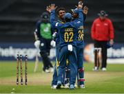 16 June 2016; Dasun Shanaka, left, of Sri Lanka is congratulated by teammates Kusal Mendis and Dinesh Chandimal after bowling out Ireland's Max Sorensen during the One Day International match between Ireland and Sri Lanka at Malahide Cricket Ground in Malahide, Dublin. Photo by Seb Daly/Sportsfile