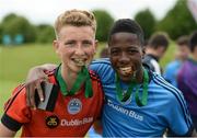 17 June 2016; DDSL goalkeeper Harry Halwax and Precious Omackore, both of St Joseph's Boys FC, celebrate with their medals after defeating Galway in a penalty shootout AET in the SFAI Kennedy Cup Final at University of Limerick in Limerick. Photo by Diarmuid Greene/Sportsfile