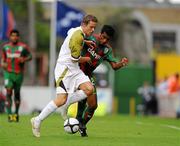 22 July 2010; Ger O'Brien, Sporting Fingal, in action against Valdecir Souza Junior, CS Marítimo. UEFA Europa League Second Qualifying Round, 2nd Leg, Sporting Fingal v CS Marítimo, Dalymount Park, Dublin. Picture credit: Barry Cregg / SPORTSFILE