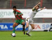 22 July 2010; Alonso Ferreira de Matos, CS Marítimo, fouls Conan Byrne, Sporting Fingal. UEFA Europa League Second Qualifying Round, 2nd Leg, Sporting Fingal v CS Marítimo, Dalymount Park, Dublin. Picture credit: Barry Cregg / SPORTSFILE