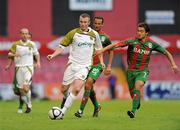 22 July 2010; Kenny Browne, Sporting Fingal, in action against Abdelmalek Cherread, left, and Marco Aurelio Iubel, CS Marítimo. UEFA Europa League Second Qualifying Round, 2nd Leg, Sporting Fingal v CS Marítimo, Dalymount Park, Dublin. Picture credit: Barry Cregg / SPORTSFILE