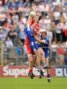 18 July 2010; Dick Clerkin and Owen Lennon, Monaghan, contest a kick out with Kevin Hughes, left, and Colm Cavanagh, Tyrone. Ulster GAA Football Senior Championship Final, Monaghan v Tyrone, St Tighearnach's Park, Clones, Co. Monaghan. Picture credit: Brendan Moran / SPORTSFILE