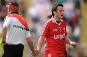 18 July 2010; Tyrone's Davy Harte shakes hands with manager Mickey Harte after being substituted late in the game. Ulster GAA Football Senior Championship Final, Monaghan v Tyrone, St Tighearnach's Park, Clones, Co. Monaghan. Picture credit: Brendan Moran / SPORTSFILE
