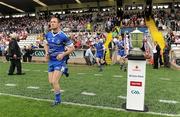 18 July 2010; Monaghan captain Vincent Corey runs out past the Anglo Celt cup before the game. Ulster GAA Football Senior Championship Final, Monaghan v Tyrone, St Tighearnach's Park, Clones, Co. Monaghan. Picture credit: Brendan Moran / SPORTSFILE