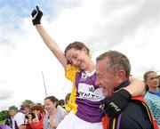 24 July 2010; Aisling Murphy, Wexford, is lifted by Denis Corrigan, Wexford Team Physio, after the final whistle. Ladies Gaelic Football Minor B All-Ireland Final, Wexford v Tipperary, Freshford GAA Grounds, Freshford, Co. Kilkenny. Picture credit: Ray Lohan / SPORTSFILE