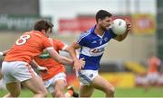 18 June 2016; Brendan Quigley of Laois in action against Charlie Vernon of Armagh during the GAA Football All-Ireland Senior Championship Qualifier Round 1A match between Laois and Armagh at O'Moore Park in Portlaoise, Co. Laois. Photo by Matt Browne/Sportsfile