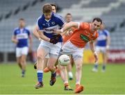 18 June 2016; Mark Timmons of Laois in action against Andy Mallon of Armagh during the GAA Football All-Ireland Senior Championship Qualifier Round 1A match between Laois and Armagh at O'Moore Park in Portlaoise, Co. Laois. Photo by Matt Browne/Sportsfile