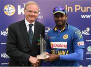 16 June 2016; Captain of Sri Lanka Anjelo Mathews is presented with the series winning trophy by Cricket Ireland President Henry Tighe during the One Day International match between Ireland and Sri Lanka at Malahide Cricket Ground in Malahide, Dublin. Photo by Seb Daly/Sportsfile