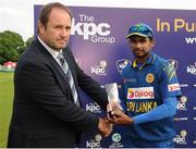 16 June 2016; Dasun Shanaka of Sri Lanka is presented the Player of the Series trophy by ICC High Performance Manager Richard Done during the One Day International match between Ireland and Sri Lanka at Malahide Cricket Ground in Malahide, Dublin. Photo by Seb Daly/Sportsfile