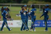 16 June 2016; Seekuge Prasanna of Sri Lanka, second left, is congratulated by teammates Dhanuska Gunathilake, centre, and wicketkeeper Dinesh Chandimal after bowling out Ireland's Gary Wilson during the One Day International match between Ireland and Sri Lanka at Malahide Cricket Ground in Malahide, Dublin. Photo by Seb Daly/Sportsfile