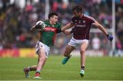 18 June 2016; Jason Doherty of Mayo is tackled by Paul Conroy of Galway during the Connacht GAA Football Senior Championship Semi-Final match between Mayo and Galway at Elverys MacHale Park in Castlebar, Co Mayo. Photo by Ramsey Cardy/Sportsfile