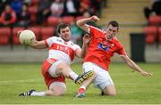 18 June 2016; Mark Lynch of Derry in action against John Binghamof of Louth during the GAA Football All-Ireland Senior Championship Qualifier Round 1A match between Derry and Louth at Owenbeg Centre of Excellence in Dungiven, Derry. Photo by Oliver McVeigh/Sportsfile