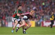 18 June 2016; Declan Kyne of Galway is tackled by Kevin McLoughlin of Mayo during the Connacht GAA Football Senior Championship Semi-Final match between Mayo and Galway at Elverys MacHale Park in Castlebar, Co Mayo. Photo by Ramsey Cardy/Sportsfile
