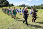 18 June 2016; Uachtarán Chumann Lúthchleas Gael Aogán Ó Fearghail and a piper before the Britain's Provincial Junior Shield Final match between Hertfordshire and Yorkshire at Frongoch in Gwynedd, Wales. Photo by Paul Currie/Sportsfile