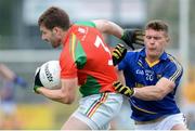 18 June 2016; Daniel St Ledger of Carlow in action against Danny Woods of Wicklow in the GAA Football All-Ireland Senior Championship Qualifier Round 1A match between Carlow and Wicklow at Netwatch Cullen Park in Carlow. Photo by Ray Lohan/Sportsfile
