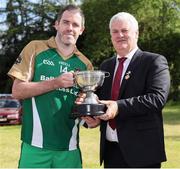 18 June 2016; Uachtarán Chumann Lúthchleas Gael Aogán Ó Fearghail presents the Wolfe Tone Cup to captain Mark Ryan after the Britain's Provincial Junior Shield Final match between Hertfordshire and Yorkshire at Frongoch in Gwynedd, Wales. Photo by Paul Currie/Sportsfile