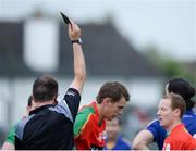 18 June 2016; Referee Pádraig O'Sullivan issues a black card to Seán Gannon of Carlow, centre, in the GAA Football All-Ireland Senior Championship Qualifier Round 1A match between Carlow and Wicklow at Netwatch Cullen Park in Carlow. Photo by Ray Lohan/Sportsfile