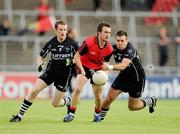 24 July 2010; Mark Poland, Down, in action against Mark Breheny, 11, and Alan Costello, Sligo. GAA Football All-Ireland Senior Championship Qualifier, Round 4, Sligo v Down, Kingspan Breffni Park, Cavan. Picture credit: Ray McManus / SPORTSFILE