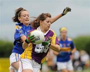 24 July 2010; Mairead Sheehan, Wexford, in action against Jessican Newman, Tipperary. Ladies Gaelic Football Minor B All-Ireland Final, Wexford v Tipperary, Freshford GAA Grounds, Freshford, Co. Kilkenny. Picture credit: Ray Lohan / SPORTSFILE