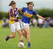 24 July 2010; Mairead Sheehan, Wexford, in action against Jessica Newman, Tipperary. Ladies Gaelic Football Minor B All-Ireland Final, Wexford v Tipperary, Freshford GAA Grounds, Freshford, Co. Kilkenny. Picture credit: Ray Lohan / SPORTSFILE