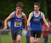 25 July 2010; Brian Barry, Tralee Harriers, receives the baton from team-mate Benny Pearse, during the Boy's U-16 4 x 100m race, at the Woodie's DIY Juvenile Track and Field Championships. Tullamore Harriers Stadium, Tullamore, Co. Offaly. Picture credit: Barry Cregg / SPORTSFILE
