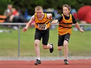 25 July 2010; Sean Callaghan, Leevale, receives the baton from team-mate Daniel O' Mahony, during the Boy's U-14 4 x 100m race, at the Woodie's DIY Juvenile Track and Field Championships. Tullamore Harriers Stadium, Tullamore, Co. Offaly. Picture credit: Barry Cregg / SPORTSFILE