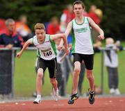 25 July 2010; Aidan Cuneeley, Craughwell, receives the baton from team-mate Damien O' Boyle, during the Boy's U-14 4 x 100m race, at the Woodie's DIY Juvenile Track and Field Championships. Tullamore Harriers Stadium, Tullamore, Co. Offaly. Picture credit: Barry Cregg / SPORTSFILE