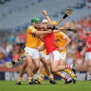 25 July 2010; Ronan Curran, Cork, in action against Shane McNaughton, Neil McManus and Simon McRory, Antrim. GAA Hurling All-Ireland Senior Championship Quarter-Final, Cork v Antrim, Croke Park, Dublin. Picture credit: Ray McManus / SPORTSFILE