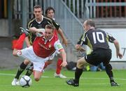 25 July 2010; Gareth O'Connor, St Patrick's Athletic, in action against Shaun Williams, left, and Alan Kirby, Sporting Fingal. Airtricity League Premier Division, St Patrick's Athletic v Sporting Fingal, Richmond Park, Dublin. Picture credit: Brian Lawless / SPORTSFILE