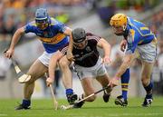 25 July 2010; Tony Óg Regan, Galway, in action against Eoin Kelly, left, and Lar Corbett, Tipperary. GAA Hurling All-Ireland Senior Championship Quarter-Final, Tipperary v Galway, Croke Park, Dublin. Picture credit: Ray McManus / SPORTSFILE