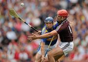 25 July 2010; Paddy Stapleton, Tipperary, in action against Irla Tannian, Galway. GAA Hurling All-Ireland Senior Championship Quarter-Final, Tipperary v Galway, Croke Park, Dublin. Picture credit: Ray McManus / SPORTSFILE