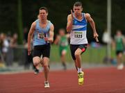 25 July 2010; Simon Doyle, St. Laurence O' Toole, on his way to win the U-19 Boy's 4 x 100m race, ahead of Ben Dennison, St. Brendan's, during the Woodie's DIY Juvenile Track and Field Championships. Tullamore Harriers Stadium, Tullamore, Co. Offaly. Picture credit: Barry Cregg / SPORTSFILE