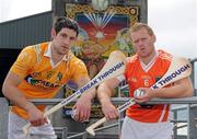 26 July 2010; Antrim captain Cormac Donnelly, left, and Armagh captain Nathan Curry under the Cuchulain Mural at Casement Park ahead of the Bord Gáis Energy Ulster GAA Hurling U-21 Final which will be staged at the Belfast ground on Wednesday evening at 7.30pm. Current title holders Antrim will face pretenders Armagh who upset the odds by beating Derry in the Semi-Finals last week. Casement Park, Belfast, Co. Antrim. Picture credit: Oliver McVeigh / SPORTSFILE