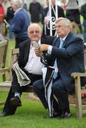 26 July 2010; Former EU Commissioner Ray MacSharry, right, and retired MP Mark Killilea relax after their first winners in the jurysinn.com Handicap Hurdle. Galway Racing Festival 2010, Ballybrit, Galway. Picture credit: Ray McManus / SPORTSFILE