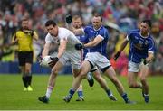 19 June 2016; Sean Cavanagh of Tyrone in action against Feargal Flanagan of Cavan during the Ulster GAA Football Senior Championship Semi-Final match between Tyrone and Cavan at St Tiernach's Park in Clones, Co Monaghan. Photo by Oliver McVeigh/Sportsfile