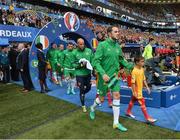 18 June 2016; John O'Shea captain of Republic of Ireland leads the team out for their UEFA Euro 2016 Group E match between Belgium and Republic of Ireland at Nouveau Stade de Bordeaux in Bordeaux, France. Photo by David Maher/Sportsfile